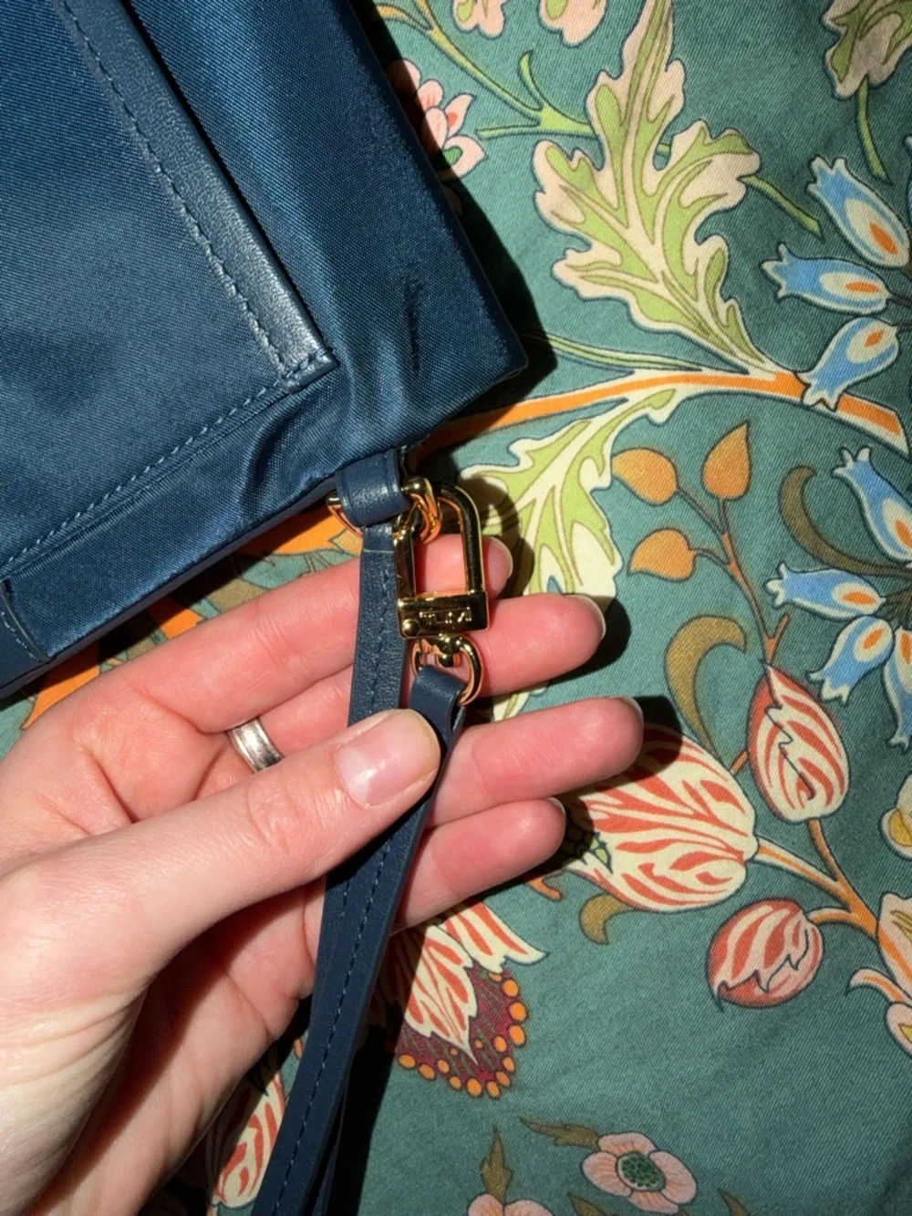 Tumi Navy Fold-Over Wristlet Clutch with Gold Hardware